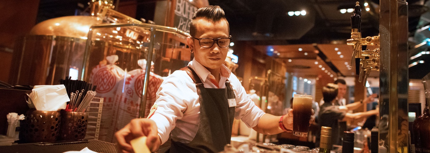 Bartender serving beer