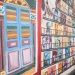 小印度区内，墙上画着的唱片架和店屋窗口与坐着的男子相映成趣