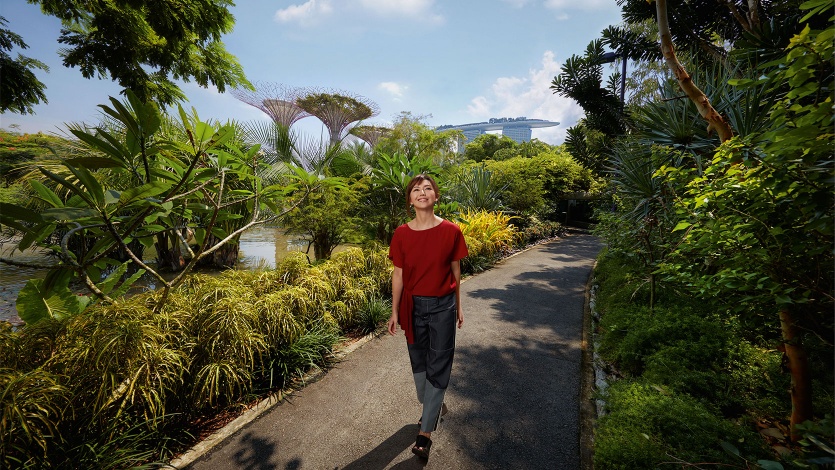 Stefanie Sun walking along a path at Gardens by the Bay