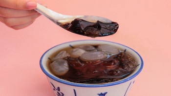 A bowl and spoonful of Chinese Gui Ling dessert at Golden Mile Food Centre Singapore
