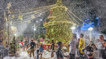 People enjoying the fake snow bubbles released outside Tanglin Mall.