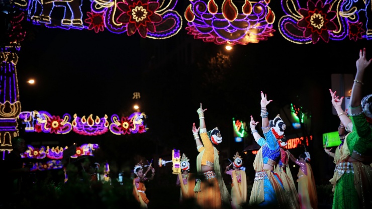 Ethnic Indian dancers on Little India’s streets during Deepavali