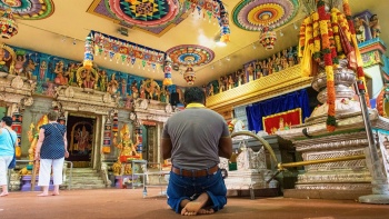 Man praying in a temple