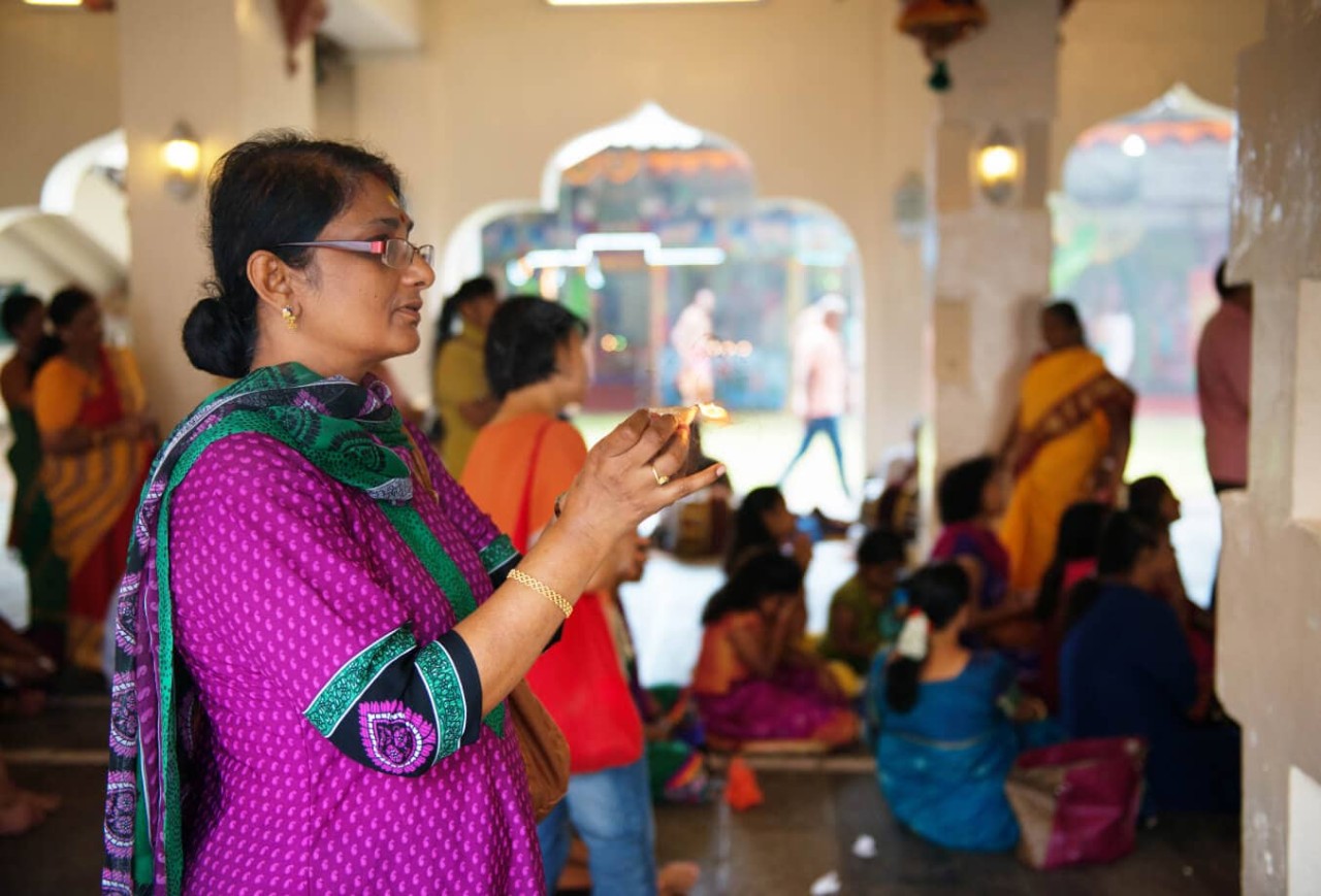 Hindu Women Praying Traditionally in Mariamman Temple