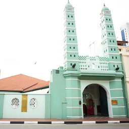 The iconic pastel green exterior of Jamae Mosque